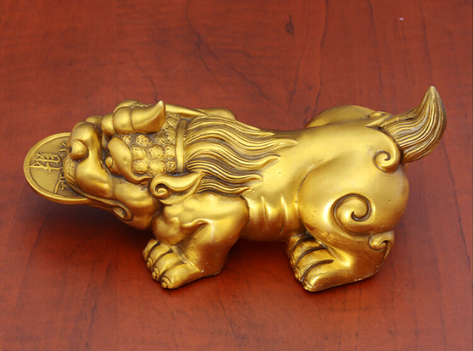 What are the differences between the Gold Swallowing Beast and the Pixiu?