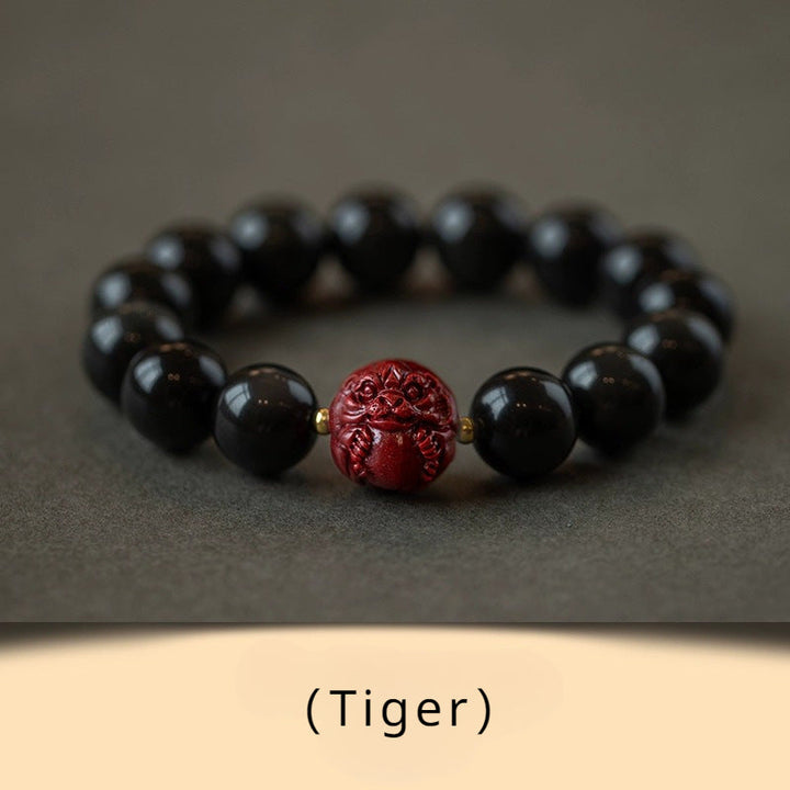 Obsidian and Cinnabar bracelet featuring the Twelve Chinese Zodiac signs for attracting good luck, protection, Buddhist guardianship, and health0